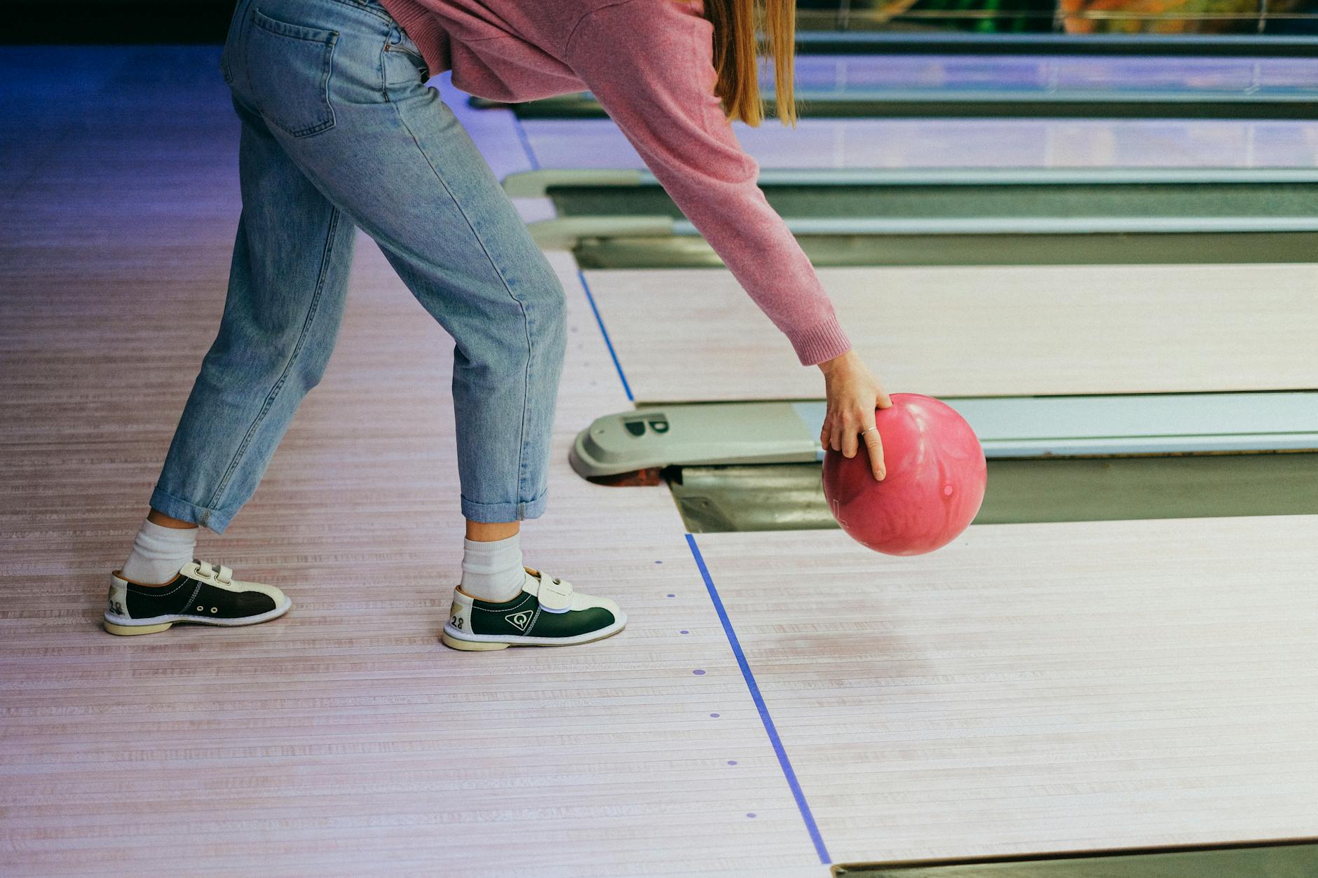 girl playing bowling