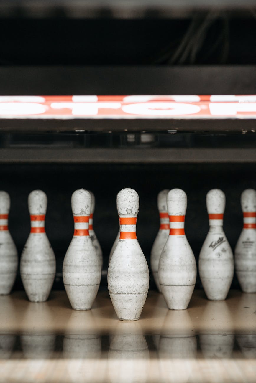 close up shot of white and red bowling pins